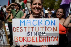 Macron cuts diminished figure in shake-up